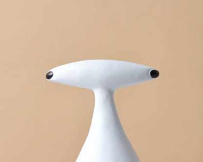 Abstract dog and alien figurines