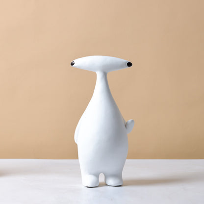 Abstract dog and alien figurines